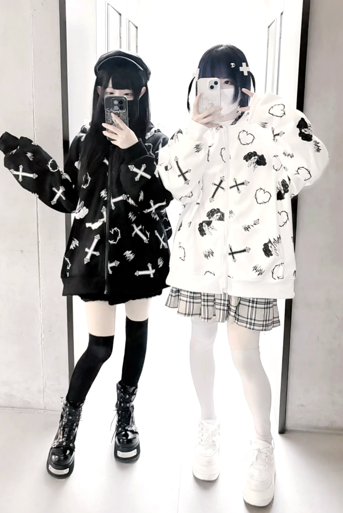 Front mirror selfie of Jirai Kei oversized bunny ear hoodie coat showcasing loose fit, cross and heart anime prints, and iconic lace-trimmed bunny ears