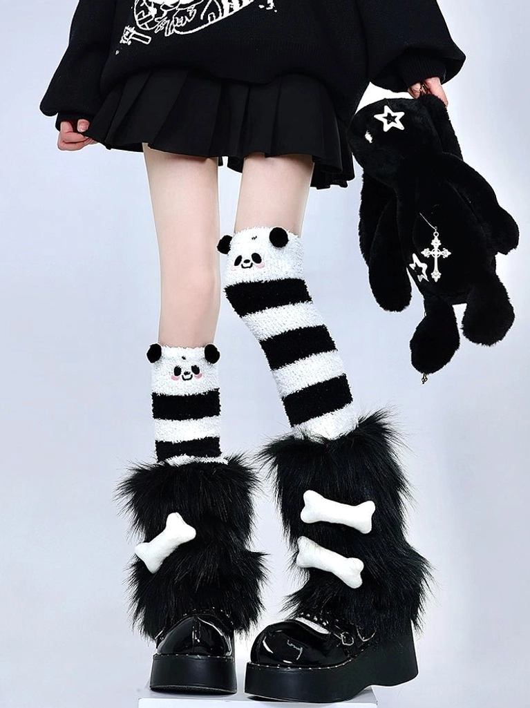 Y2K panda striped thigh-high socks black plush leg warmers white bone accents black pleated skirt punk studio outfit front leg view