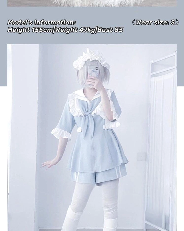Front mirror selfie of pastel blue sailor Jirai Kei two-piece set with ruffled sailor collar, front bow, and matching shorts displayed with model size watermark and frilly headpiece