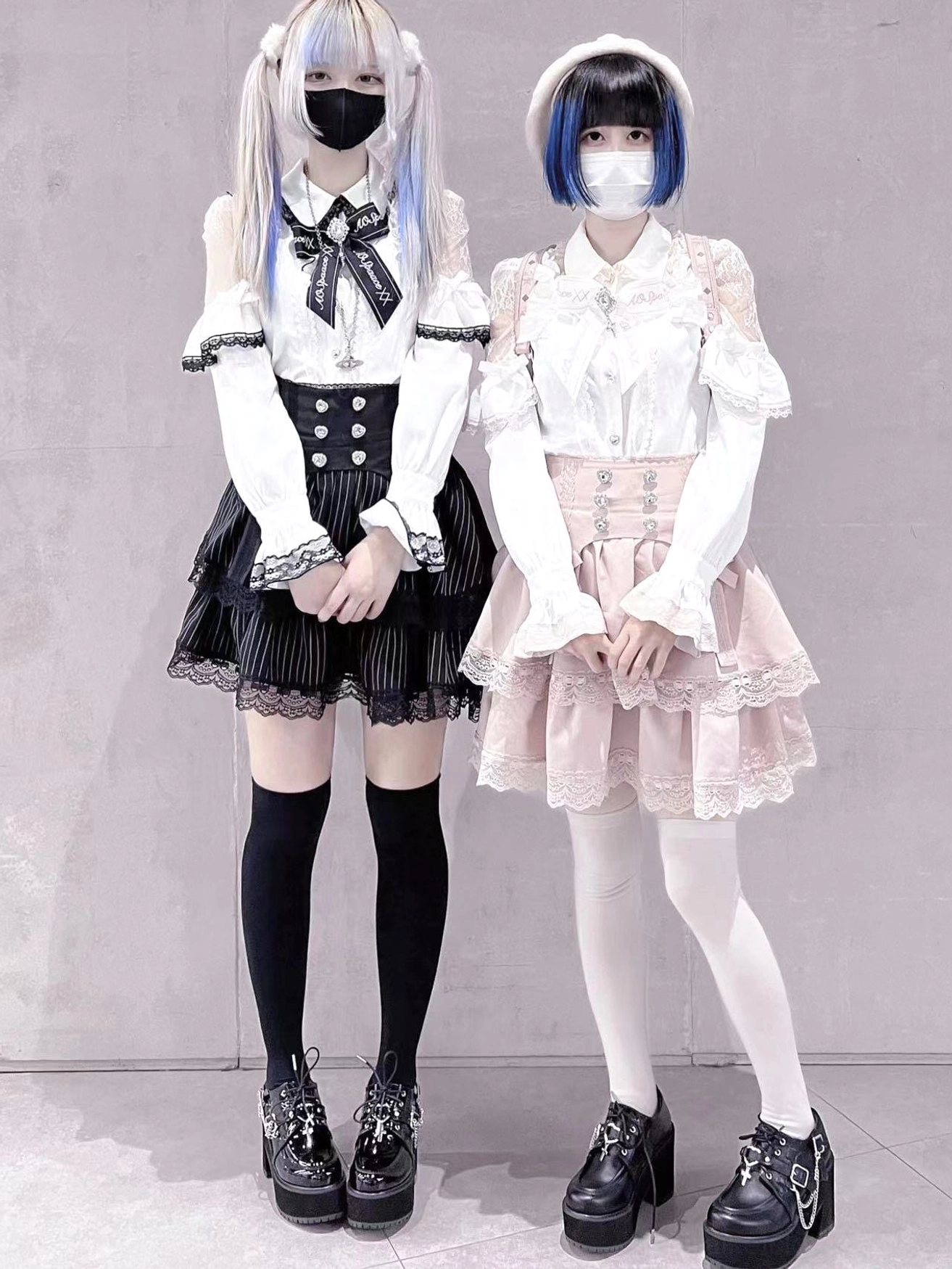 Jirai Kei patchwork blouse and mini skirt two-piece set full-body front view on models with bicolor styling and lace ruffle details