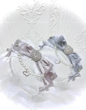 Jirai Kei pearl bow headband gray-blue and gray-pink color variants with heart rhinestone charm lace trim flat lay display