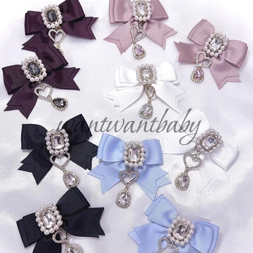 Multi-color Jirai Kei pearl rhinestone bow hair clips overhead flat lay display showing all available colorways with heart teardrop pendants