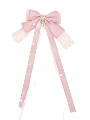 Pink lace bow hair clip with pearl-beaded ribbon tail and heart-shaped rhinestone accent for Jirai Kei ponytail styling