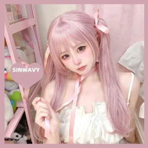 Pink Jirai Kei lolita twin ponytail wig front display on model wearing white dress against pink backdrop, showcasing matte pink hair texture and authentic hairline