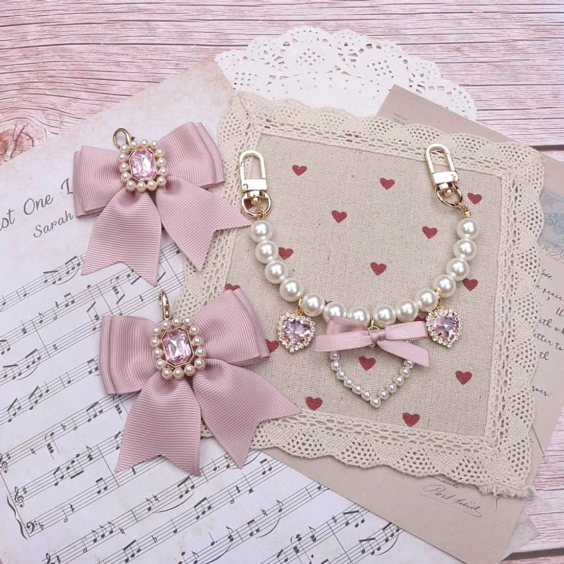 Pink satin bow Jirai Kei bag charm pink rhinestones mixed metal pearl chains heart pendants