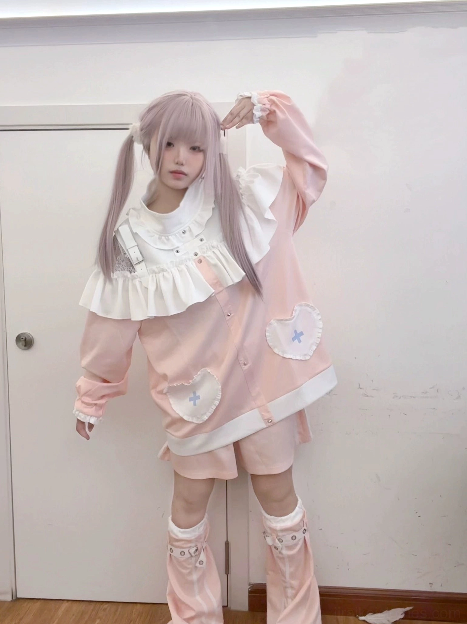 Pink Jirai Kei sweatshirt and shorts set with heart-cross pockets and white ruffled collar, worn with matching leg warmers in full-body front view, embodying sweet subculture fashion