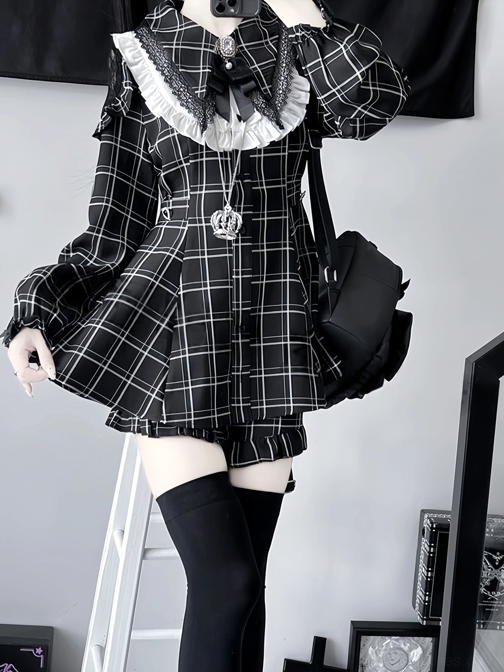 Black plaid Jirai Kei dress set long-sleeved with white lace collar and long puff sleeves, carrying handbag half-body front view