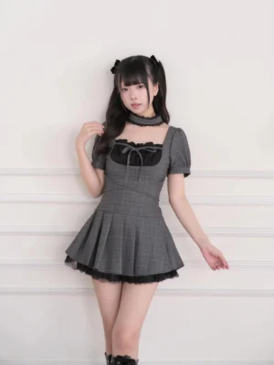 vintage plaid square neckline mini dress with puff sleeves hand-tied bow and lace-trimmed pleated hem front view