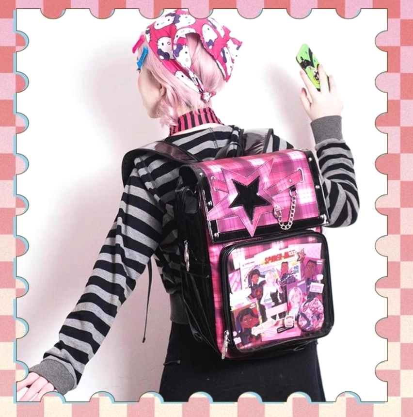 Jirai Kei plaid star ita backpack lifestyle shot with anime collectible badges and charm accessories