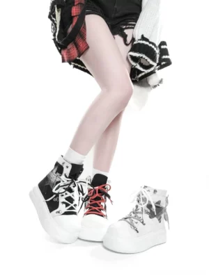 Side view of dual-color platform high-top canvas shoes with foldable collar and contrasting dual laces styled on model in punk subculture aesthetic