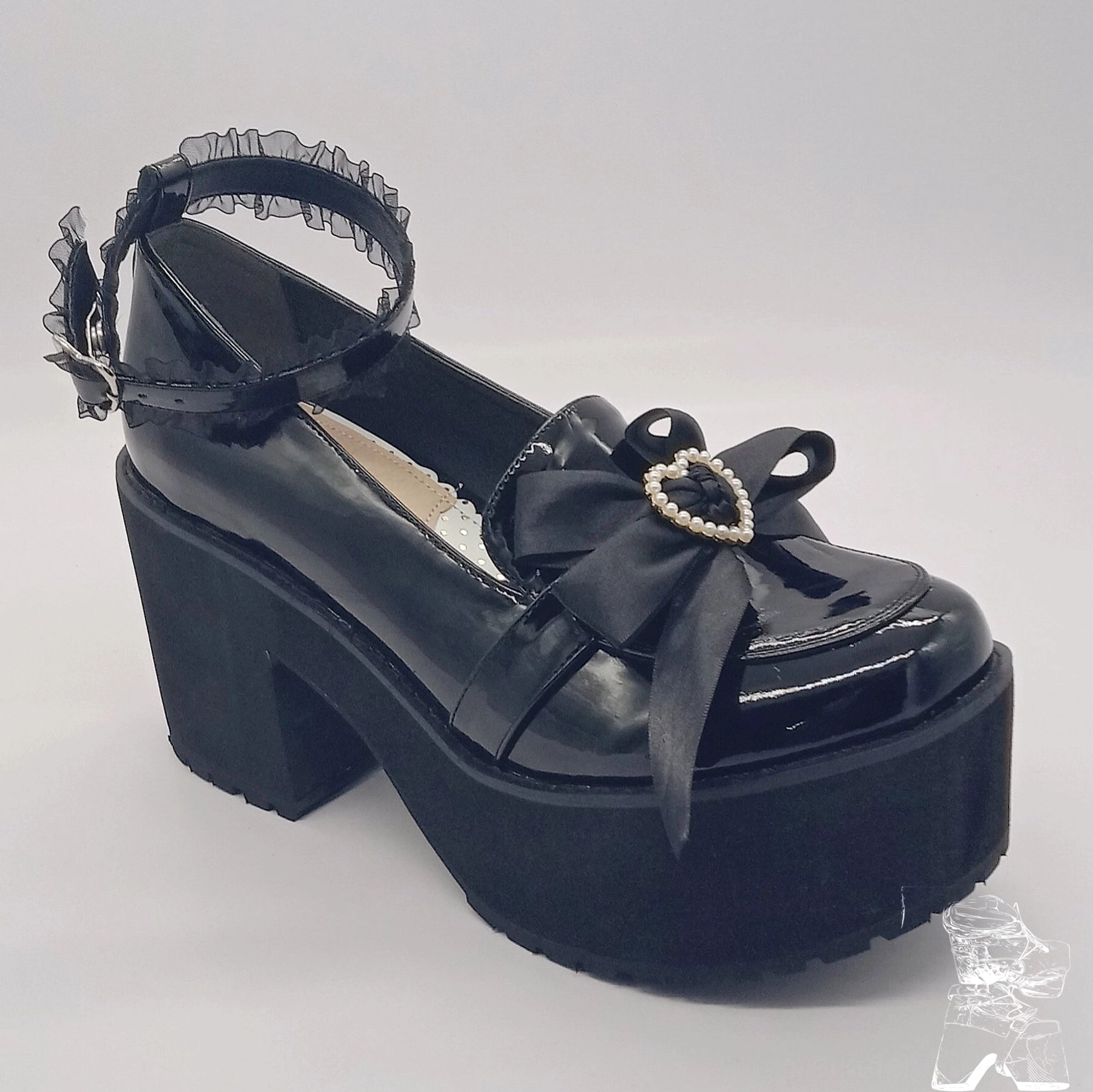 Single black patent platform heel oblique front view lace ankle strap heart pearl bow ornament thick block platform heel