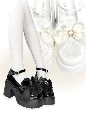 Dual-tone Jirai Kei platform loafers front and side view featuring black patent leather style with gem bow and white organza bow variant displayed on white stockinged legs studio background