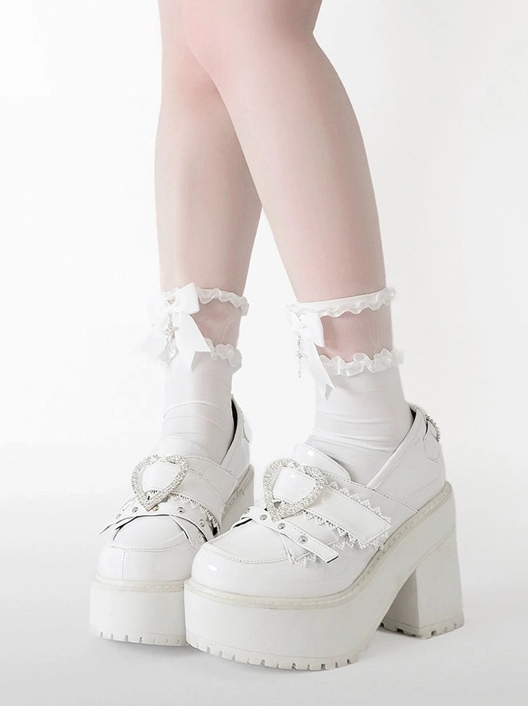 Bottom sole view of Jirai Kei heart platform loafers showing thick EVA platform construction, chunky block heel height measurement 9.5 cm, and durable sole material