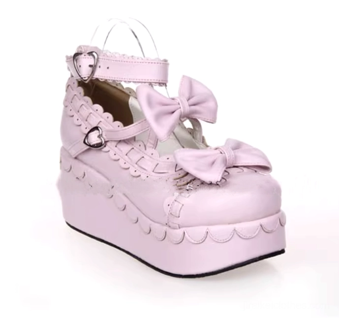 All pink monochromatic Jirai Kei platform shoes with bow accents and heart ankle buckle side three-quarter view