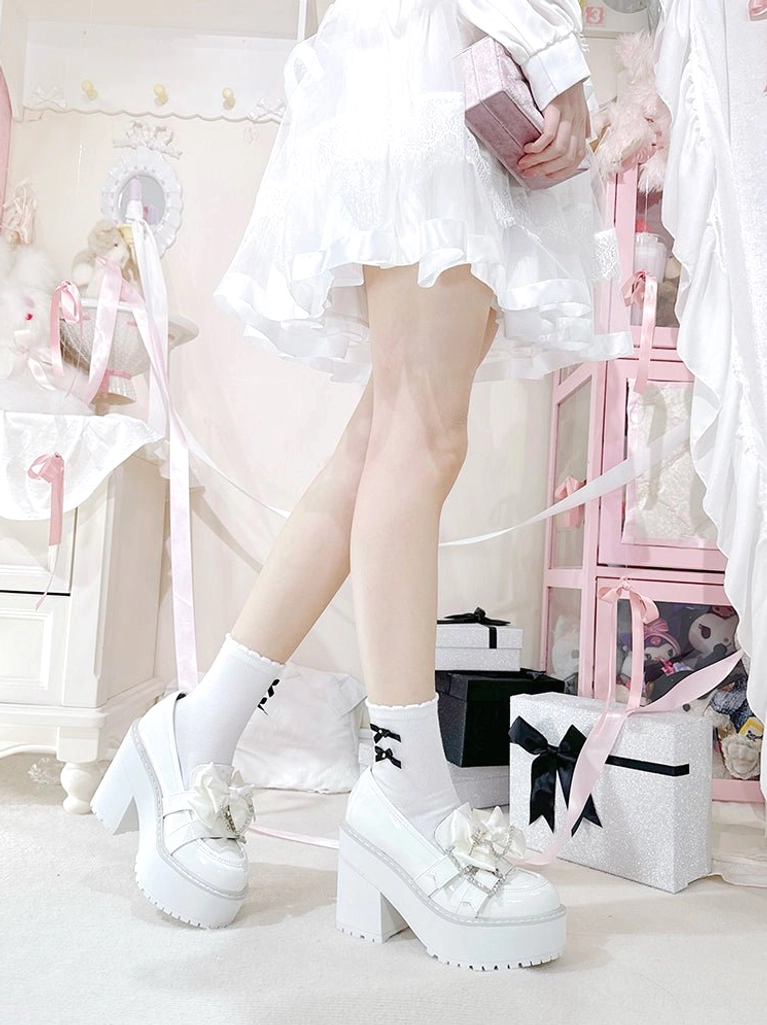 Jirai Kei platform shoes comparison view showing both black and white patent leather variants side-by-side, demonstrating rhinestone details and platform heel consistency across color options