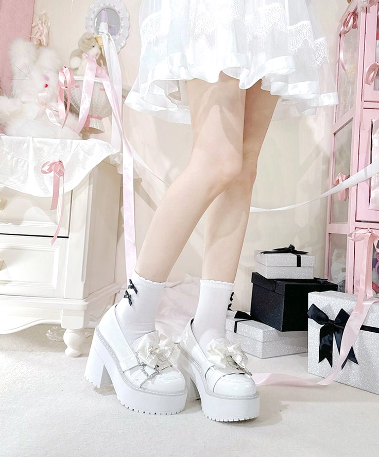 Jirai Kei platform shoes care and maintenance guide visual showing proper storage in dust bags, shoe trees, and how to preserve glossy patent leather finish and rhinestone decorations
