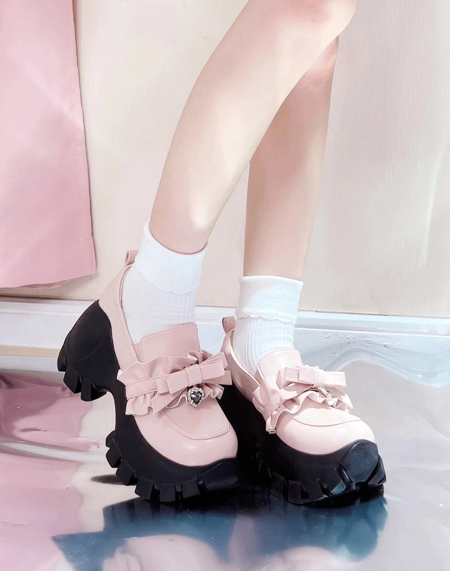 Jirai Kei platform shoes collection showing multiple color options including black and pink finishes with heart bow details