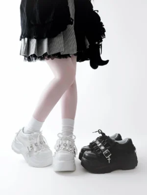 Black and white heart rhinestone jirai kei platform shoes front view low angle model wearing gothic lolita outfit with white crew socks