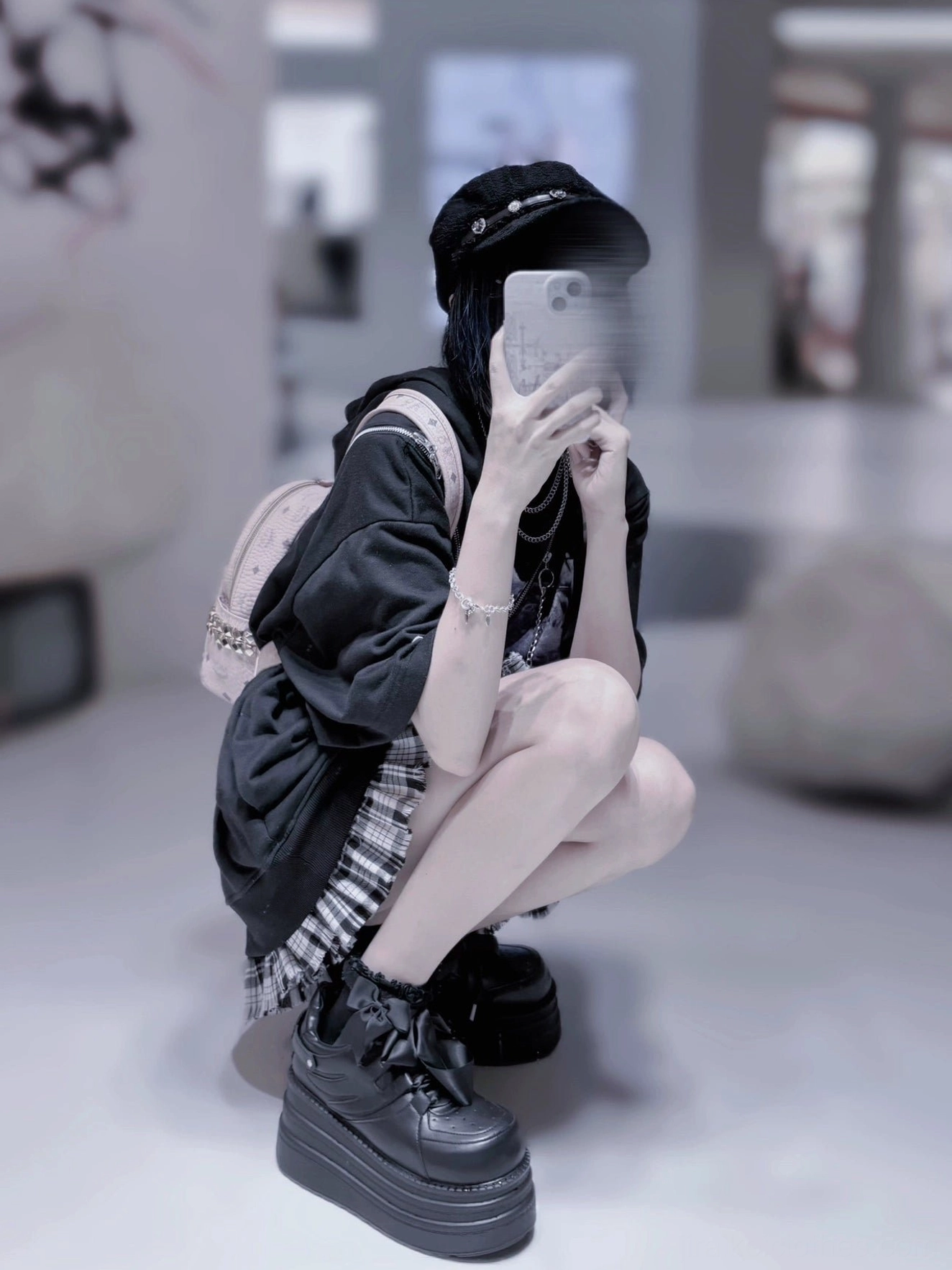 Jirai Kei platform sneakers low oblique view indoor room squatting goth model all-black platform face smartphone