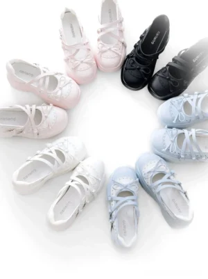 Four color options of Jirai Kei platform lolita sneakers including black, white, blue and white, and pink displayed in flat lay arrangement