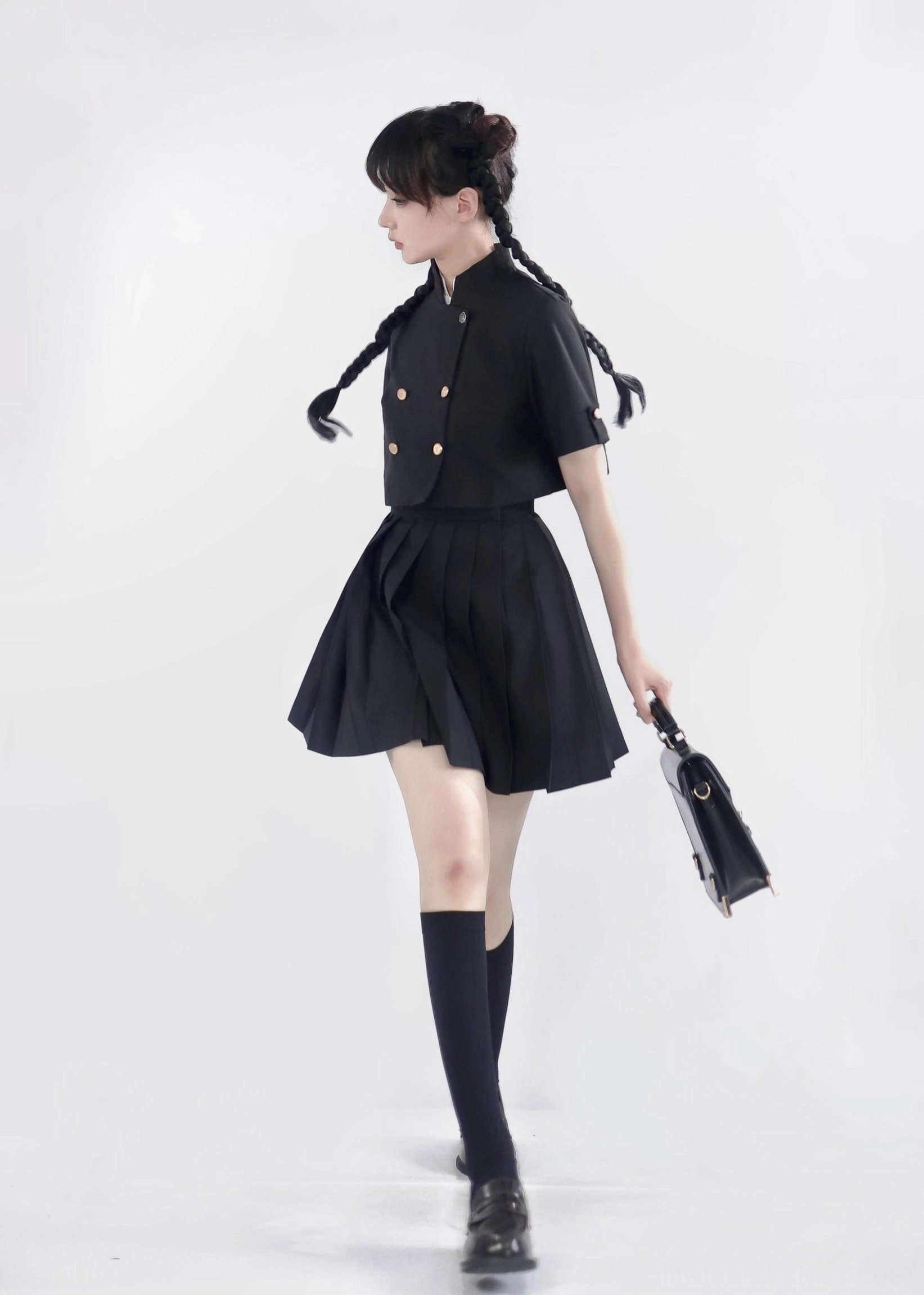 Jirai Kei uniform pleated skirt embroidered waistband red detail close-up studio photography black fabric