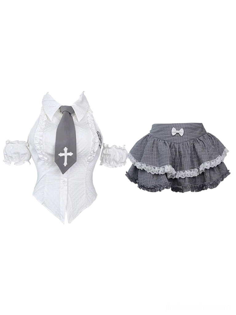 Flat lay display of jirai-kei two-piece outfit set showing white corset halter top with embroidered cross tie and gray double-layered plaid mini skirt with white lace trim and bow accents