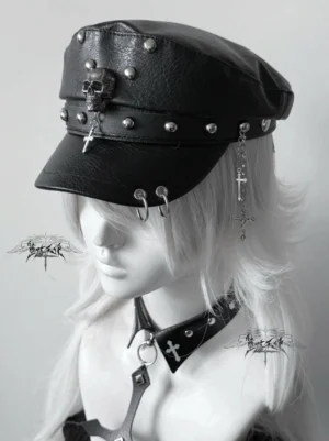 Jirai Kei punk leather newsboy cap with pure black brim, metal studs, skull cross dangles and brim ring decorations left side view