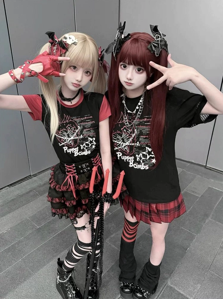 Jirai Kei Clothes, punk aesthetic outfit ensemble featuring graphic strawberry chain t-shirt and red plaid heart skirt full styling perspective