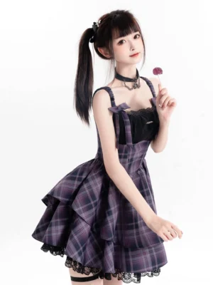 Purple plaid Jirai Kei lolita dress with black lace bust and bow straps front three-quarter view on model
