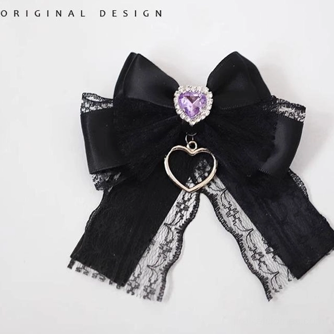 Purple short ribbon Jirai Kei hair clip with compact bow design and rhinestone accents, fashion accessory product shot for subculture styling