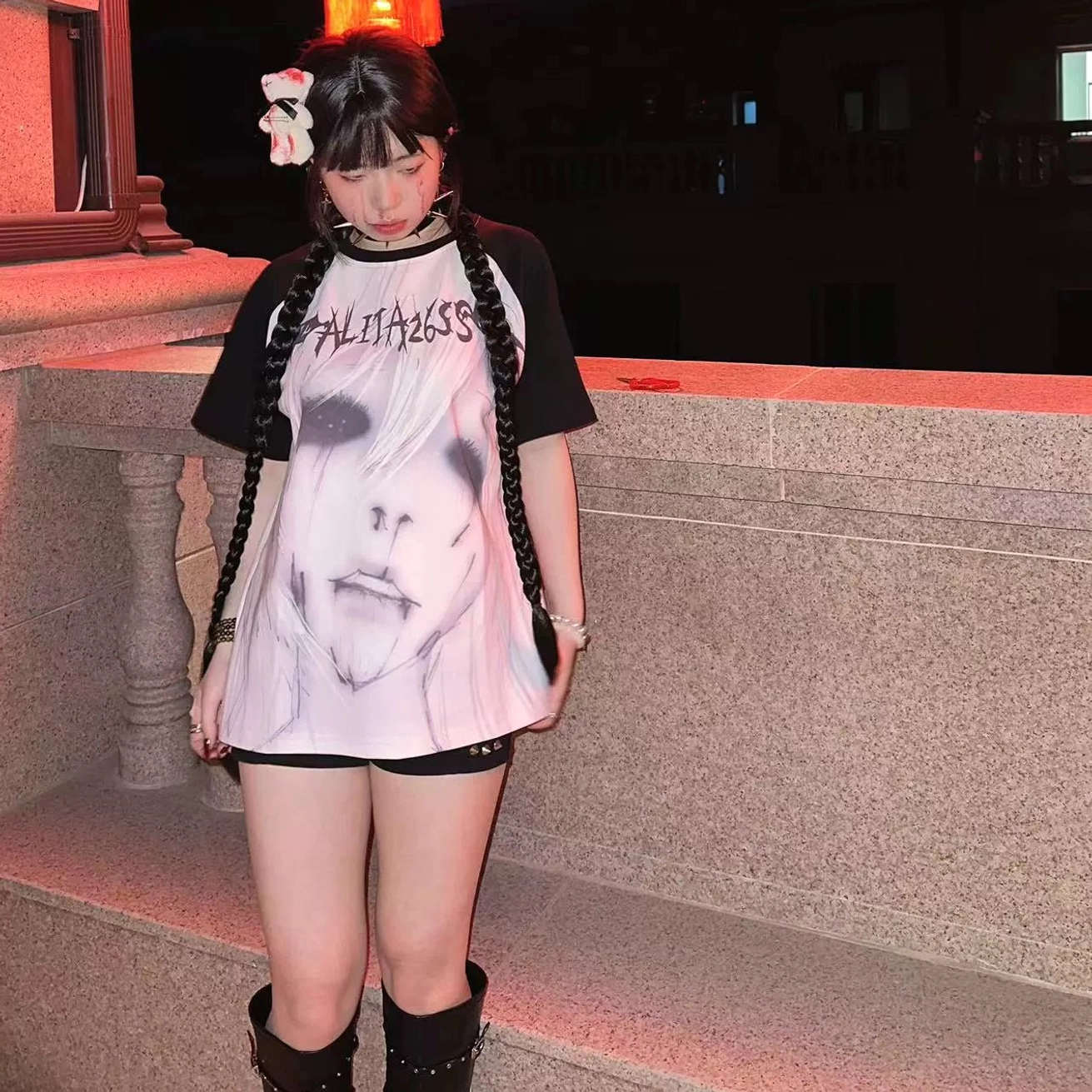 Jirai Kei contrast sleeve T-shirt on model with light pink base and ALITA26SS text print with dark anime face graphic