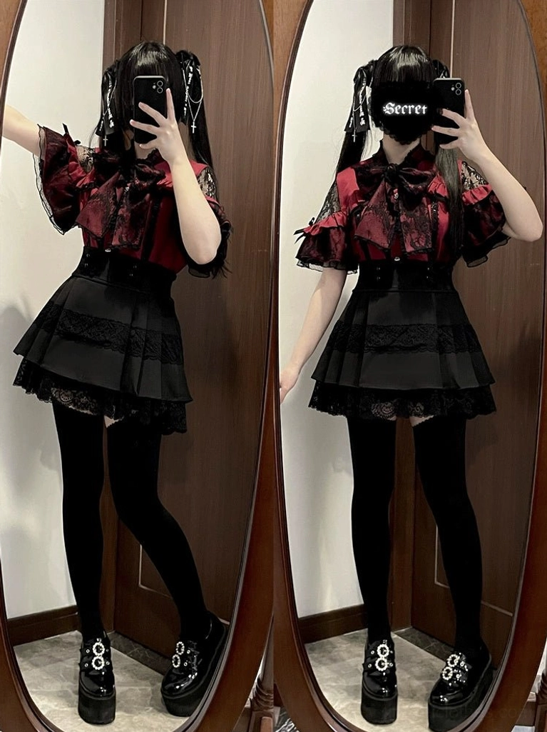 Red jirai kei blouse bold statement styling full-body shot with ruffled sleeves and heart-shaped embellishments