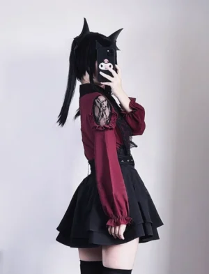 Jirai Kei outfit with lace-trimmed wine red blouse and pleated black skirt shown from side angle with model wearing cute accessories