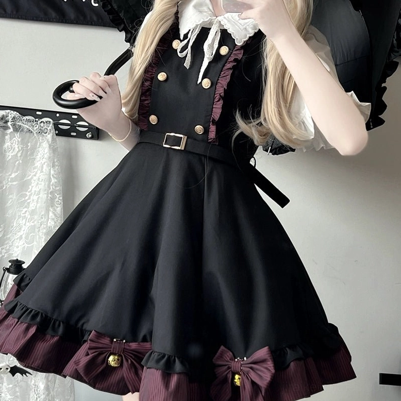 Jirai Kei red skirt variation detail close-up showing decorative bells with striped trim creating auditory and visual dimension in school uniform aesthetic