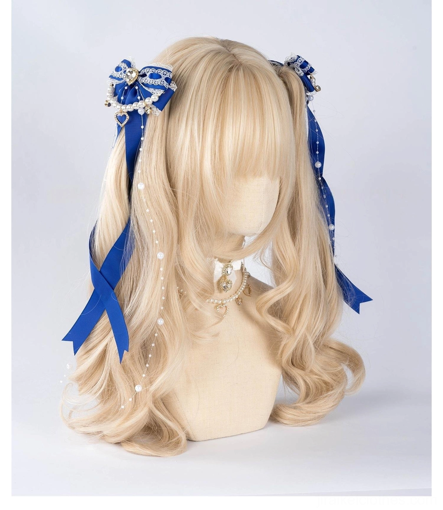 Jirai Kei royal blue ribbon bow hair clips with pearl chain accents and metallic decorative choker displayed on mannequin front view