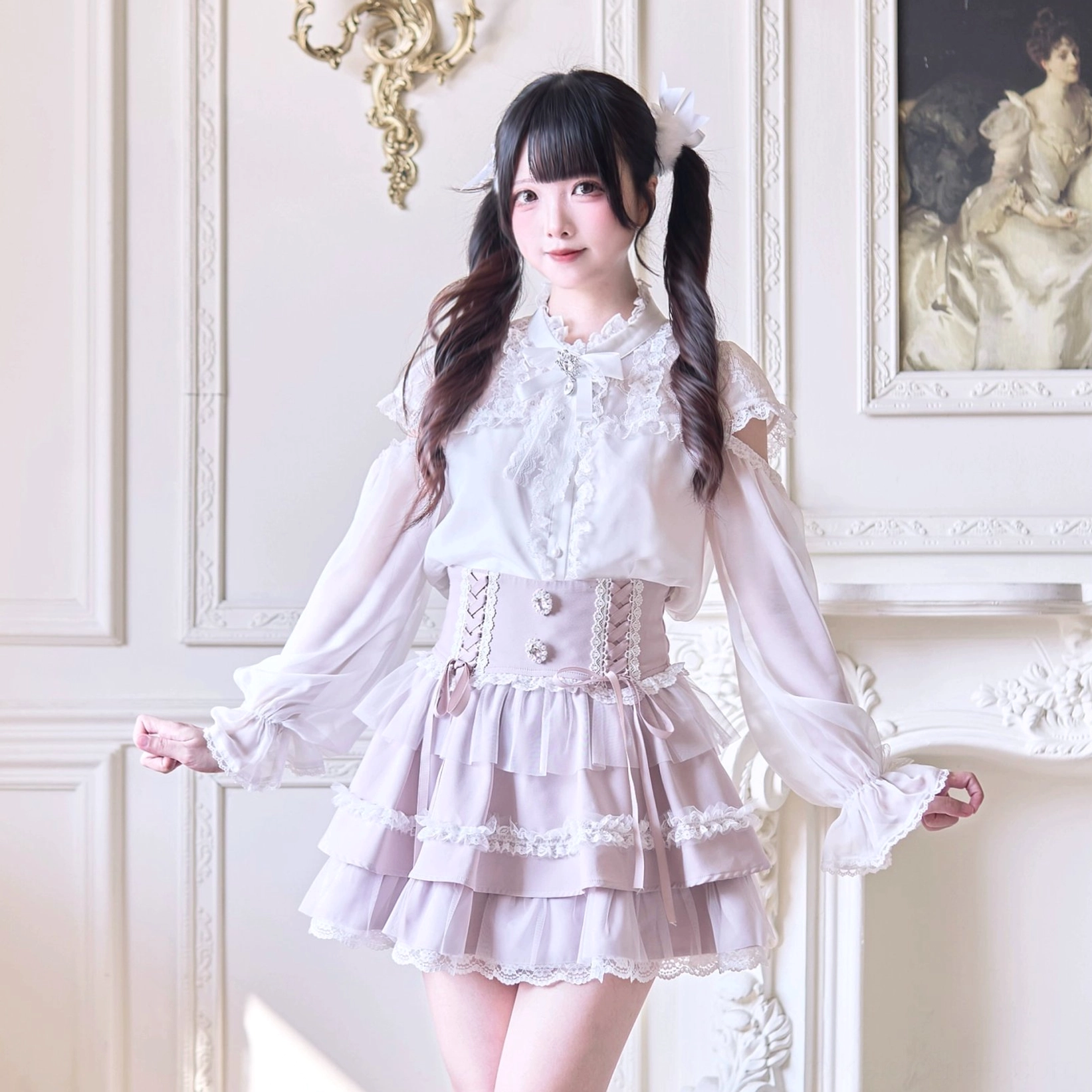 Close front view of Jirai Kei ruffle skirt highlighting detailed corset waist design with pearl rhinestones and cross-ribbon accents in pink