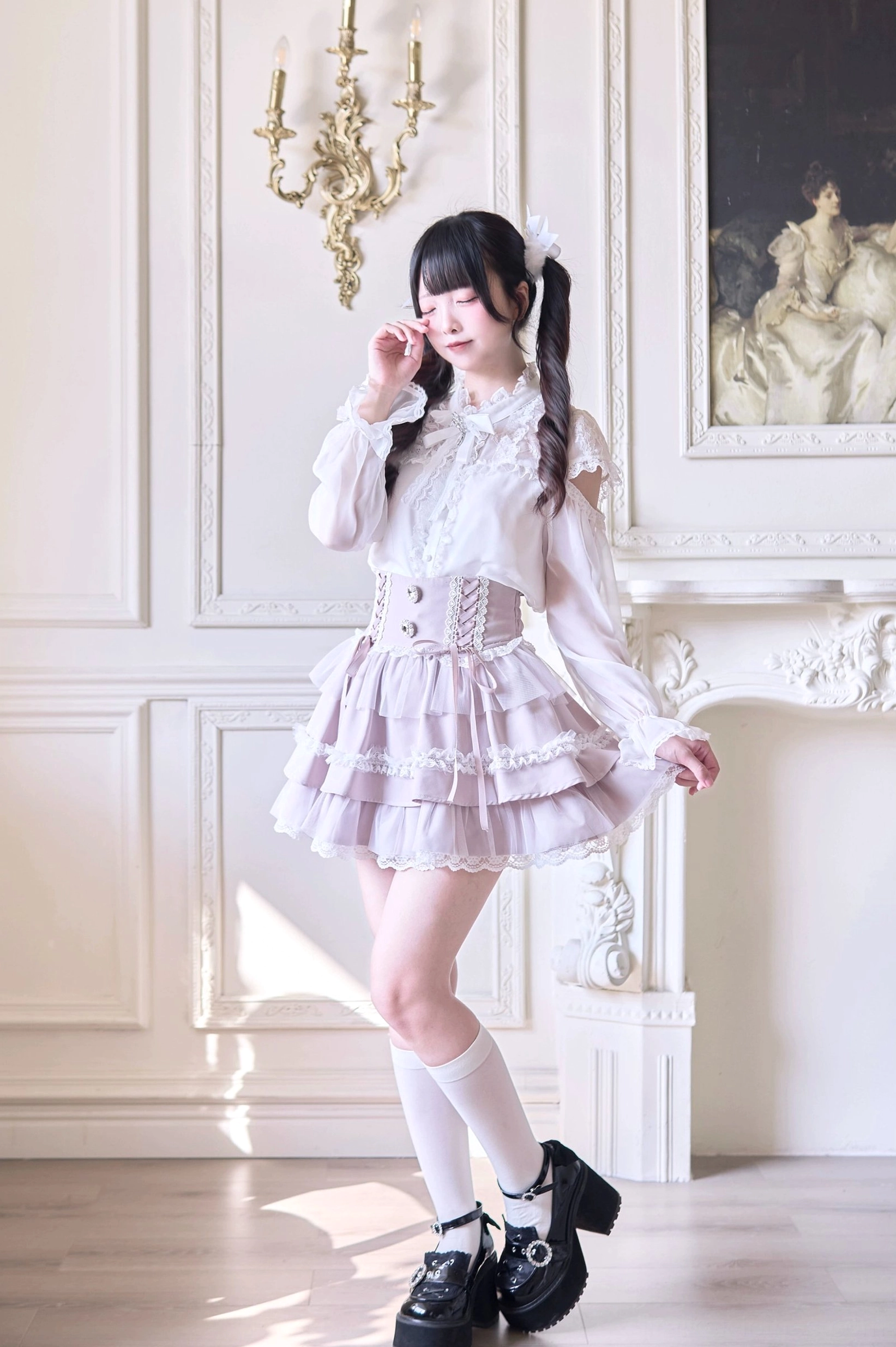 Elegant side profile of tiered lace Jirai Kei skirt with corset waistband and decorative ribbons in lavender coloring