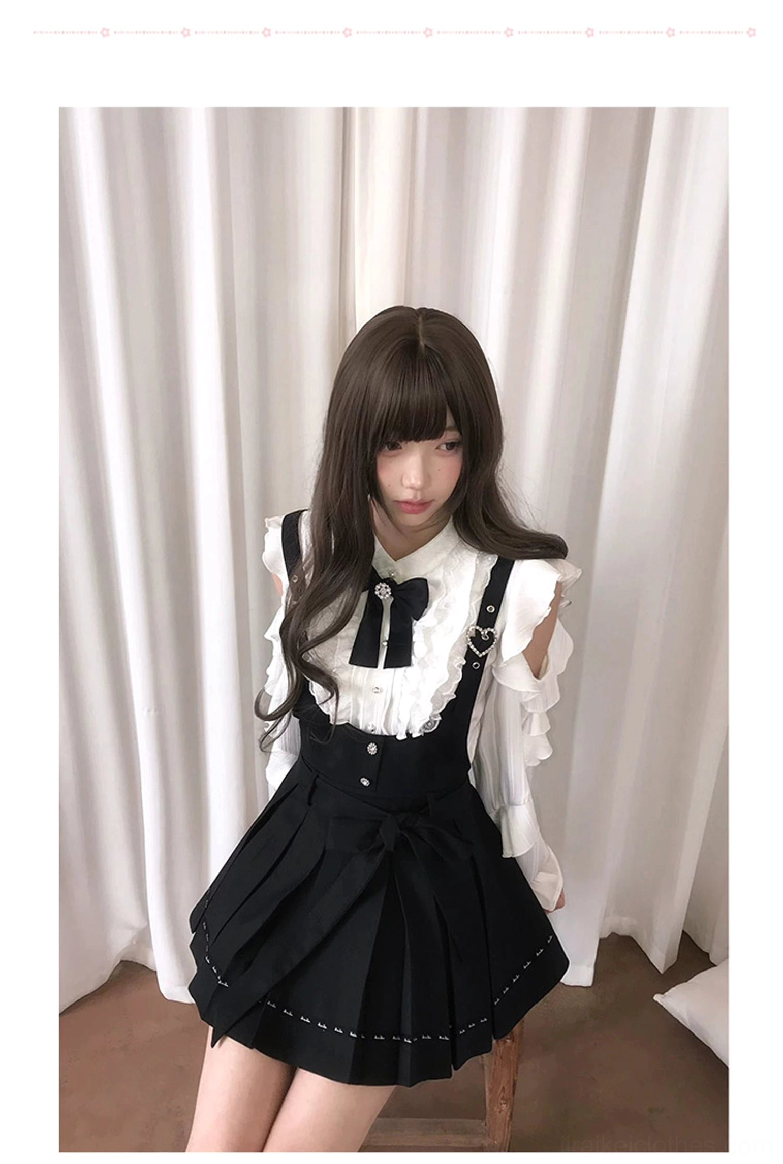 Jirai Kei suit low-angle full-body view model wearing ruffled off-shoulder blouse pleated skirt with topstitching trim matching bow