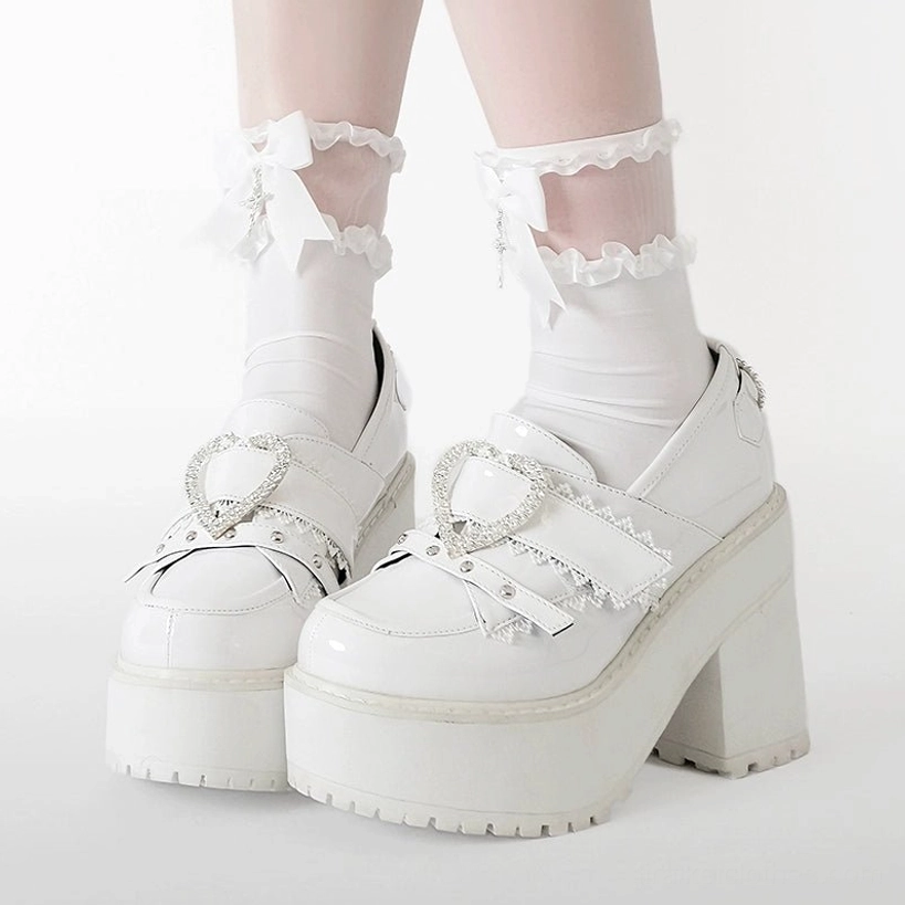 Jirai Kei Ryousangata platform loafers styling flat lay arrangement showing all color options patent black white and patent pink with decorative props and accessories