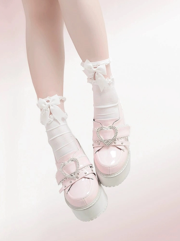 Patent pink Jirai Kei Ryousangata platform loafers showcasing eye-catching color option, glossy finish, heart rhinestone buckle, and sweet-meets-tough aesthetic appeal