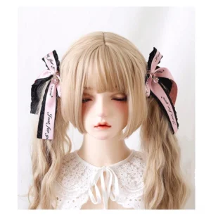 Jirai Kei Ryousangata twin bow hair clips with pink and black ribbons featuring Just for you text print and metal pendants on blonde twin-tail BJD doll model front view