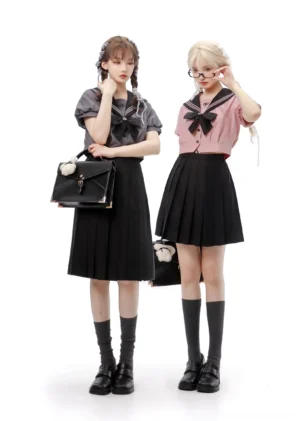Jirai Kei sailor school uniform full-body front view two models matching leather handbags knee-high socks black pleated skirt sailor collar blouse