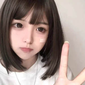 Jirai Kei short bob wig with neat air bangs front view on plain background showing realistic dark brown-black straight hair texture