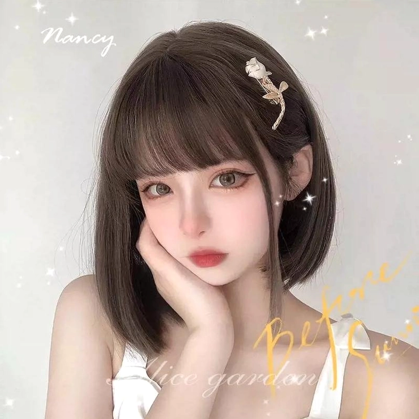 Dark brown short bob Jirai Kei wig on model with starry decorative background and rose hairpin front close-up styling
