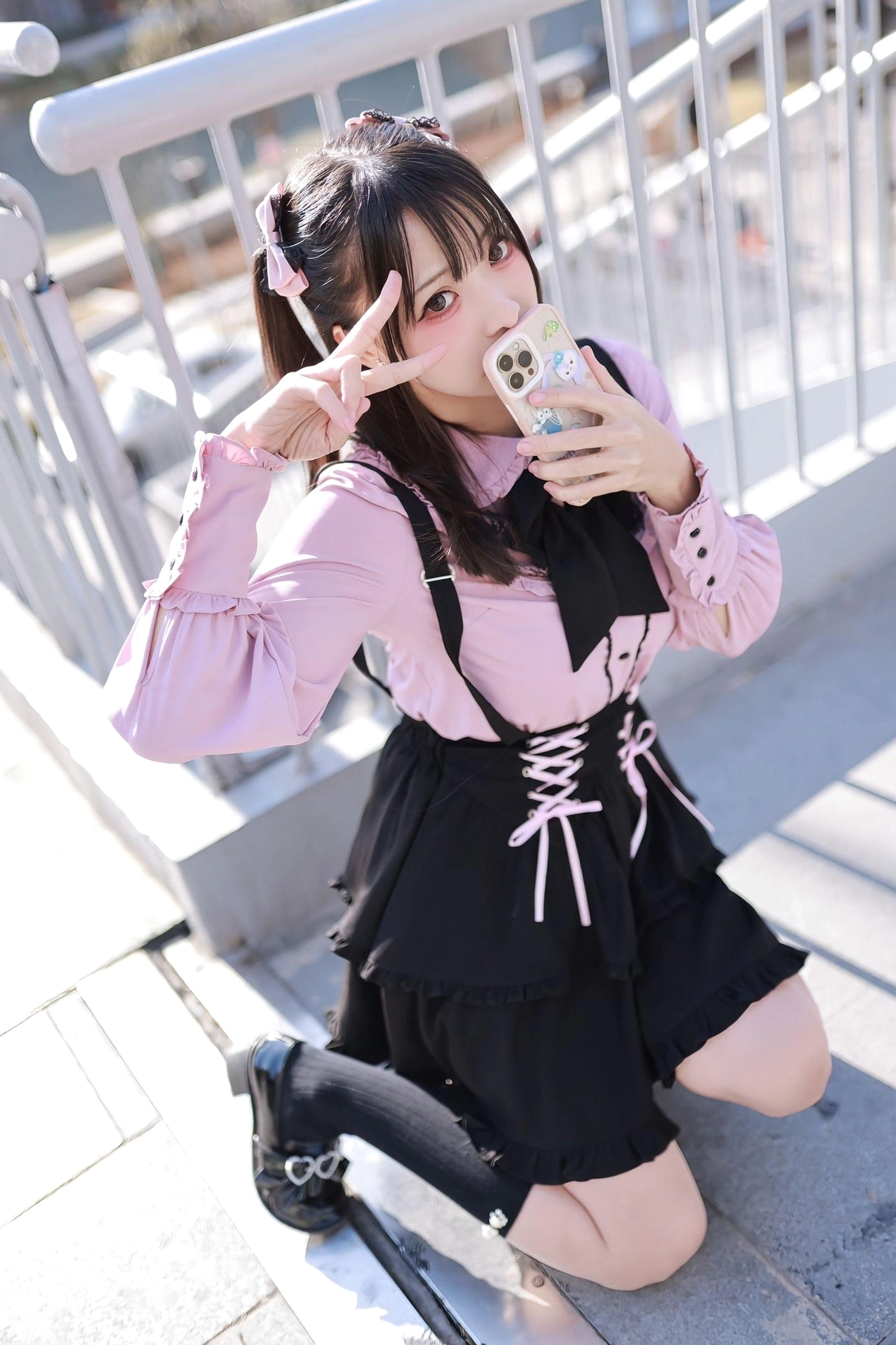 Jirai Kei outfit construction detail showing ruffled hem layers, lace-up waist mechanism, and double-layer skirt design for dramatic aesthetic volume