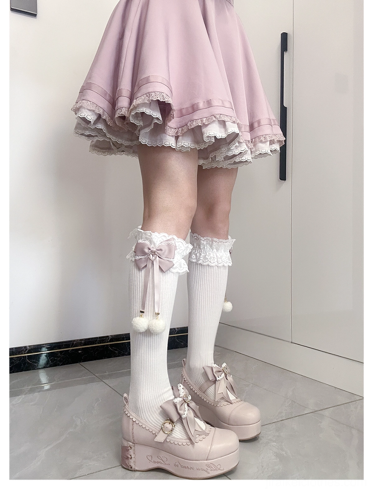 Jirai Kei lace bow pom-pom socks heart accent detail close-up showing delicate heart decoration on lace bow and pom-pom charm craftsmanship