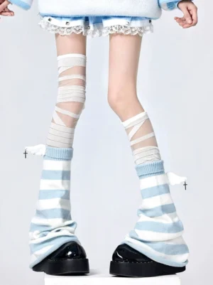 Jirai Kei striped leg warmers with wing charms and bandage thigh socks front full leg view featuring blue-white horizontal stripes and cross-wing decorative charms worn with lace mini skirt and striped knit top