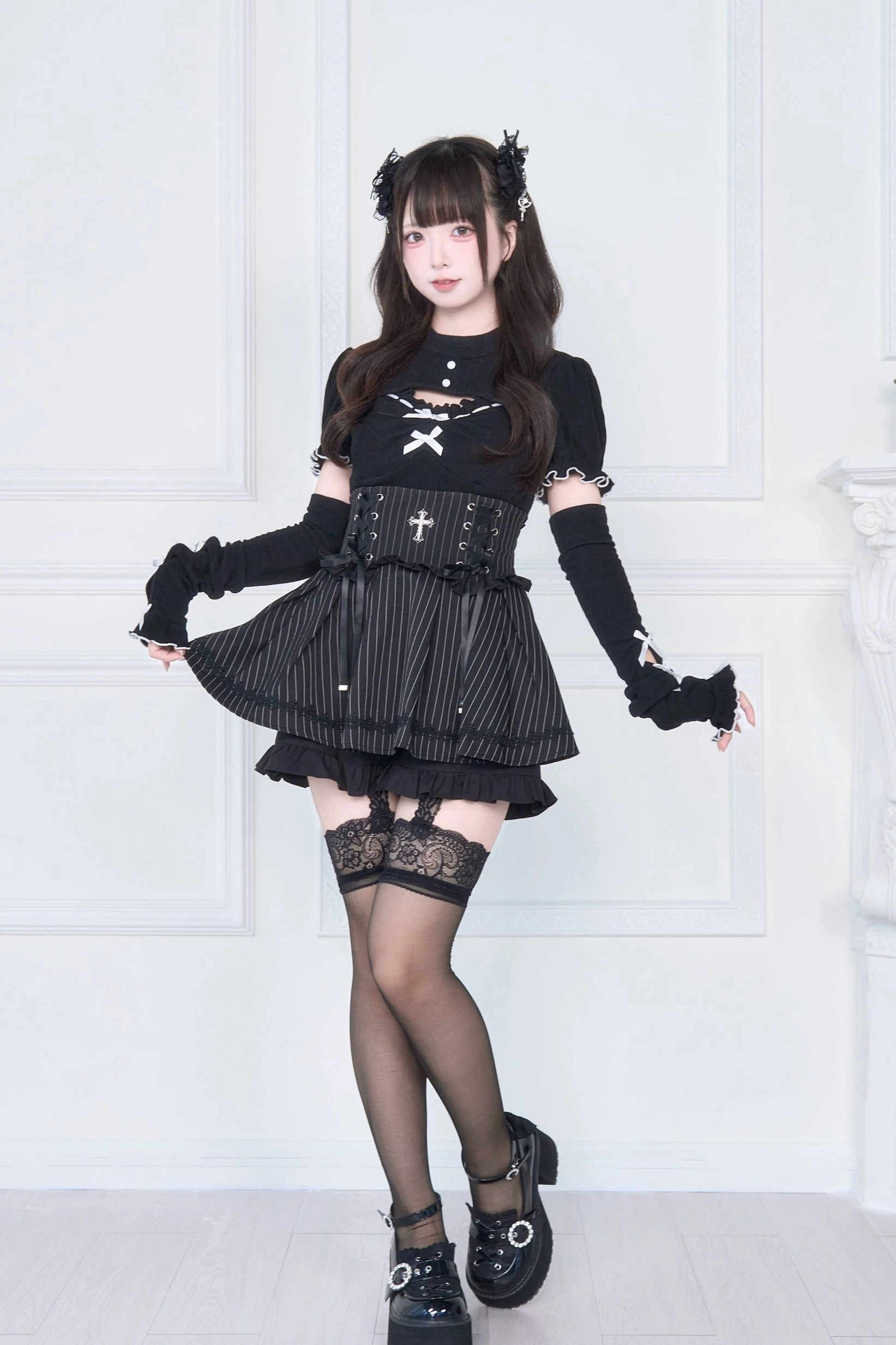 Striped Jirai Kei ruffle skirt with black cutout knit top side-front view showing cross corset and lace details