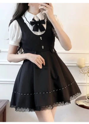 Black Jirai Kei suspender skirt with lace trim and metal cross decoration front view detail