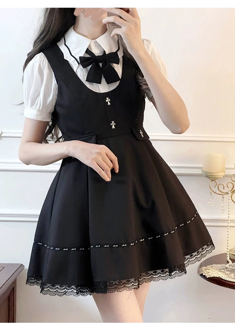 Black Jirai Kei suspender skirt with lace trim and metal cross decoration front view detail